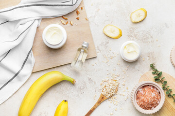 Composition with banana cosmetics on light background