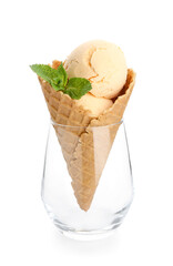 Glass with mango ice cream on white background