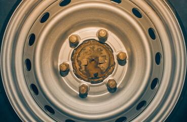 Flat Lay or Top View Six Car Wheel Nut on Wheel Hub and Wheel Rim in Vintage Tone