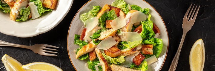 Chicken Caesar salad overhead flat lay panorama