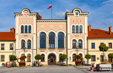 Naklejka premium City hall building with colorful town tenement houses at historic city center market square in Zywiec, Silesia region of Poland