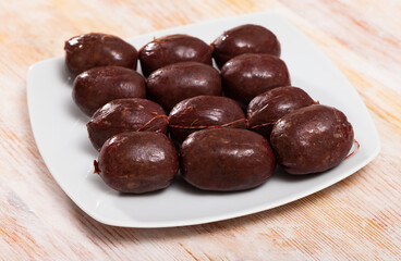 Blood sausage black pudding on wooden background