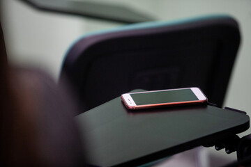 Row of business people listening to presentation at seminar