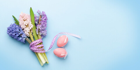 Easter greeting card with easter eggs and hyacinth flowers