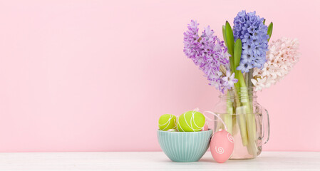 Easter greeting card with easter eggs and hyacinth flowers