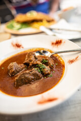 Beef or veal goulash served in a plate with juice stew, served in a plate