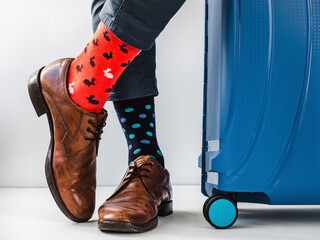 Men's legs, trendy shoes and bright socks. Close-up. Style, beauty and elegance concept