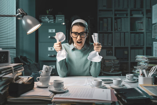 Stressed Angry Employee Working Late At Night