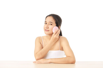 Woman with using silicone cleansing facial brush