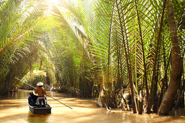 People boating in the delta of Mekong river, Vietnam