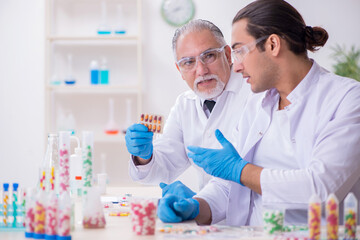 Two chemists working in the lab