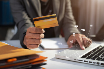 Businessman hold credit cards, conduct financial transactions via tablets and data documents, put...