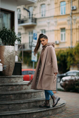 Fototapeta premium Cute sexy happy smiling brunette walking around the city