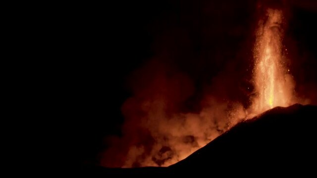 Paroxysmal activity of the Sicilian volcano Etna during the day of 24 February 2021. Explosions, lava and column of smoke that covered the neighboring Etna villages with ash and lapilli.