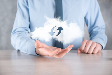 Cloud technology. Polygonal wireframe cloud storage sign with two arrows up and down on dark ....