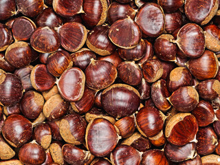 solid fresh ripe chestnuts, top view, background
