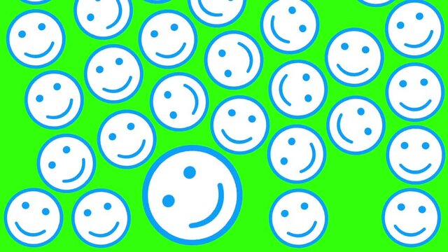 Digital animation of blue smiley emoticons icons on a green background. Falling from top to bottom. They fill the entire frame. Internet communication concept. Social networks. abstract smile face.