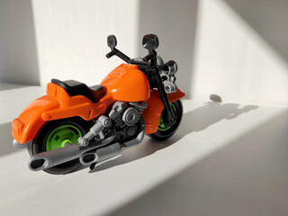 Motorcycle toy on white background with shadow