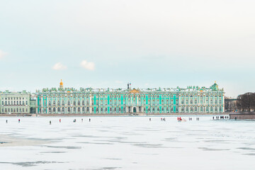 View of the Hermitage (Winter Palace) from the embankment of St. Petersburg from the icy Neva...