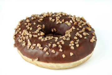 Chocolate donut encrusted with nuts isolated on white.