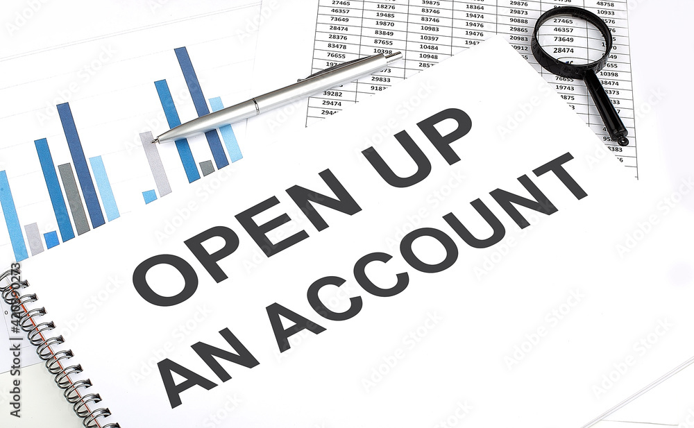 Poster in the notebook, the text open up an account , next to magnifier and a pen, the background is graphi