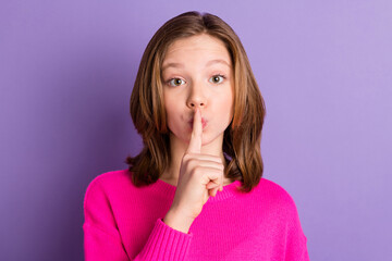 Photo of young charming pretty voiceless little girl pout finger on lips silence isolated on purple...