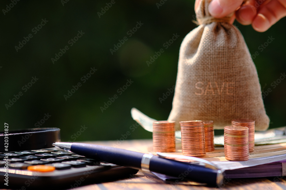 Poster stack of coin on table background and saving money and business growth concept