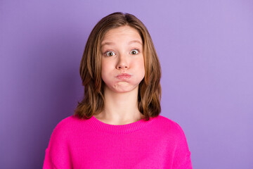 Fototapeta premium Photo of funky cute cheerful teenage girl hold breath cheeks funny face isolated on violet color background