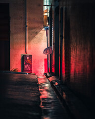 Man alone in a dark alleyway