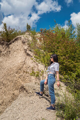 Fototapeta premium portrait of beautiful fashion woman traveler to desert and relax on sand