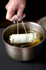 chef making tempura roll in the restaurant