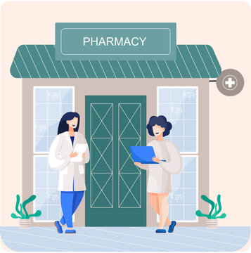 Facade pharmacy store with signboard, awning and symbol in shopwindow. Pharmacists women at entrance