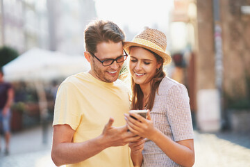 Happy tourists sightseeing during summer holidays