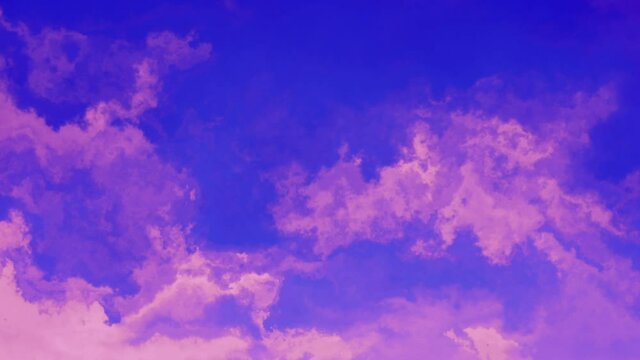 Pink wispy clouds against blue sky
