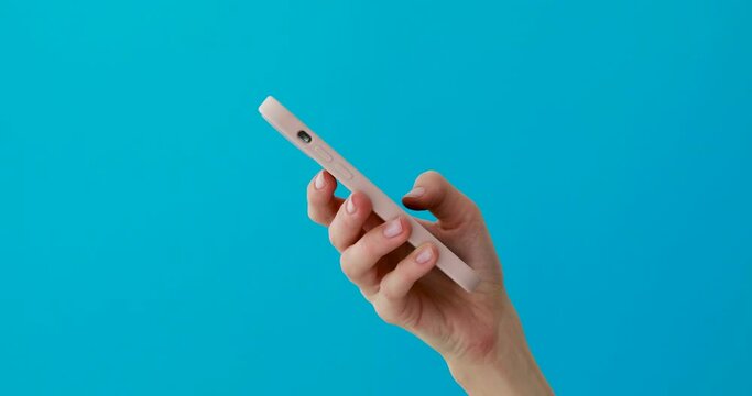 Close-up phone in hand studio side view