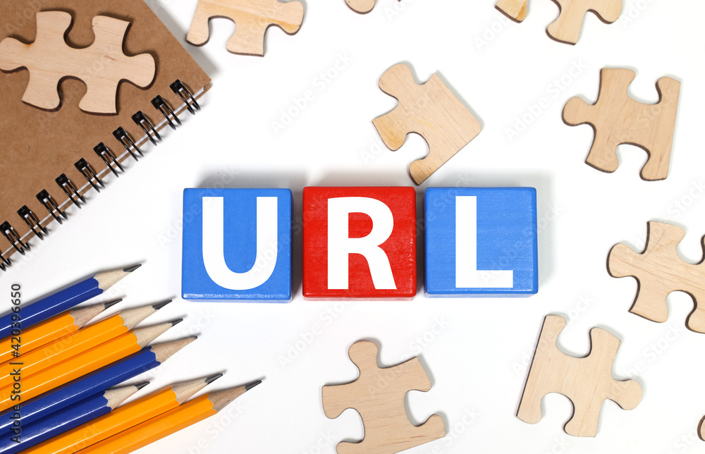Poster word url - uniform resource locator. text on wood cubes. text in black letters on wood blocks