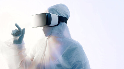 Futuristic laboratory. Doctor in protective suit with VR glasses performing research in virtual reality simulation. High quality photo