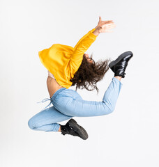 Young African American woman dancing over isolated white background