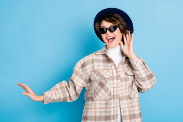 Photo of young excited girl happy positive smile have fun enjoy wear vintage hat isolated over blue color background