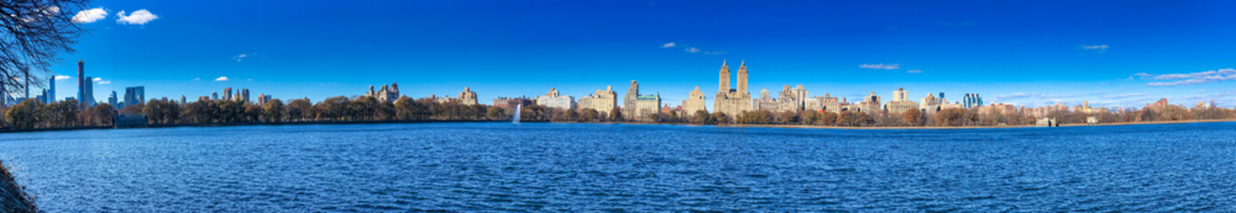 Panoramic view of buildings along Central Park Lake in New York City