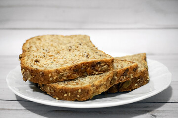 Sprouted Whole Grains Sliced Bread close up. Healthy eating concept.