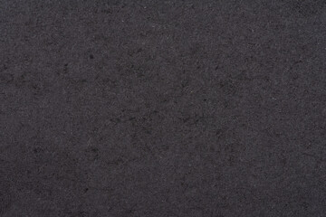Textured blank black sheet of cardboard or paper. Background