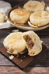 Chinese Mid-Autumn Festival Su shi moon cake on wood background