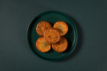Chinese Mid-Autumn Festival moon cake on on green plate