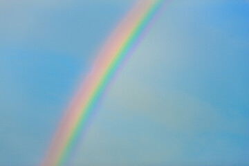 Rainbow in clear blue sky