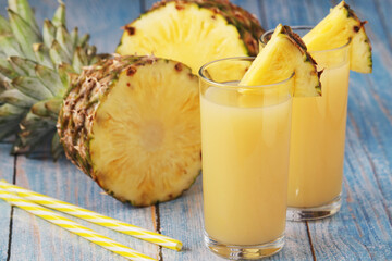 Fototapeta na wymiar Two glasses with pineapple juice