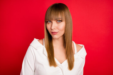 Photo of young attractive blond hair woman confident serious wear blouse isolated over red color background