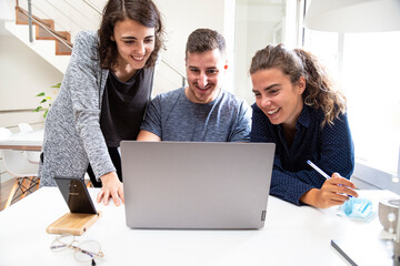 Group of young entrepreneurs working on a new project. Startup concept.