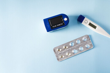 Health care thermometer heart rate monitor and pill packaging.