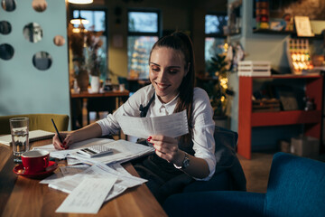 manager dealing with finances in her restaurant